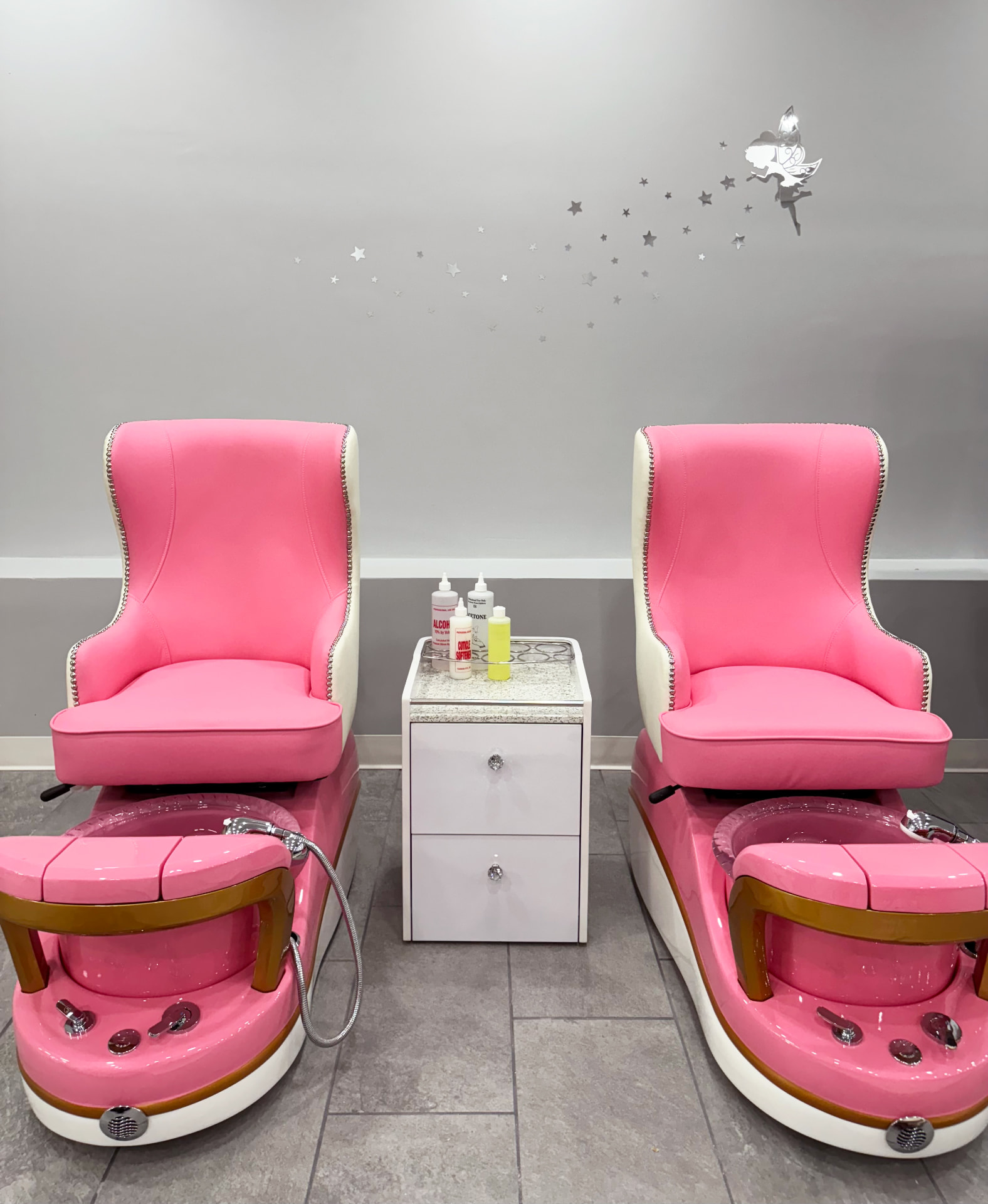 Pink spa pedicure chairs in the kids and classic pedicure room